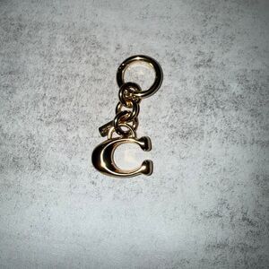 Coach c brass gold charm